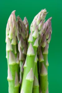 green asparagus fresh on green background nutrients from plants iron