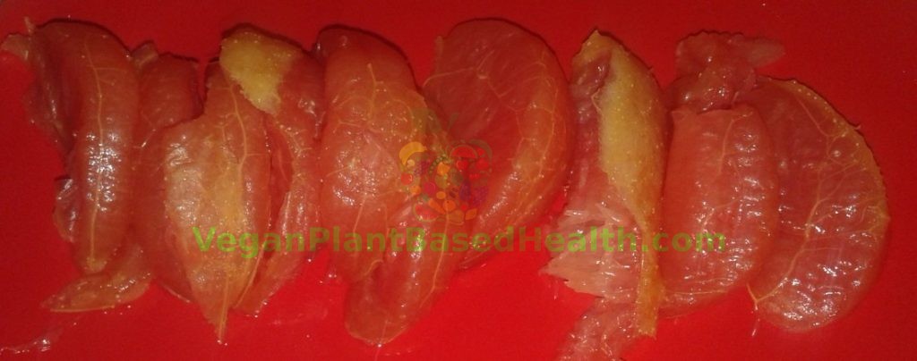 frozen thawed separated grapefruit on red plate what i eat in a day