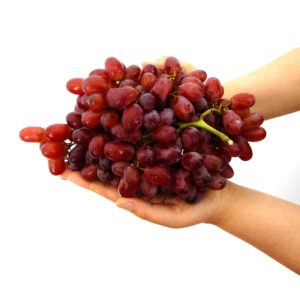 dietary myths red grapes in hands white background high sugar