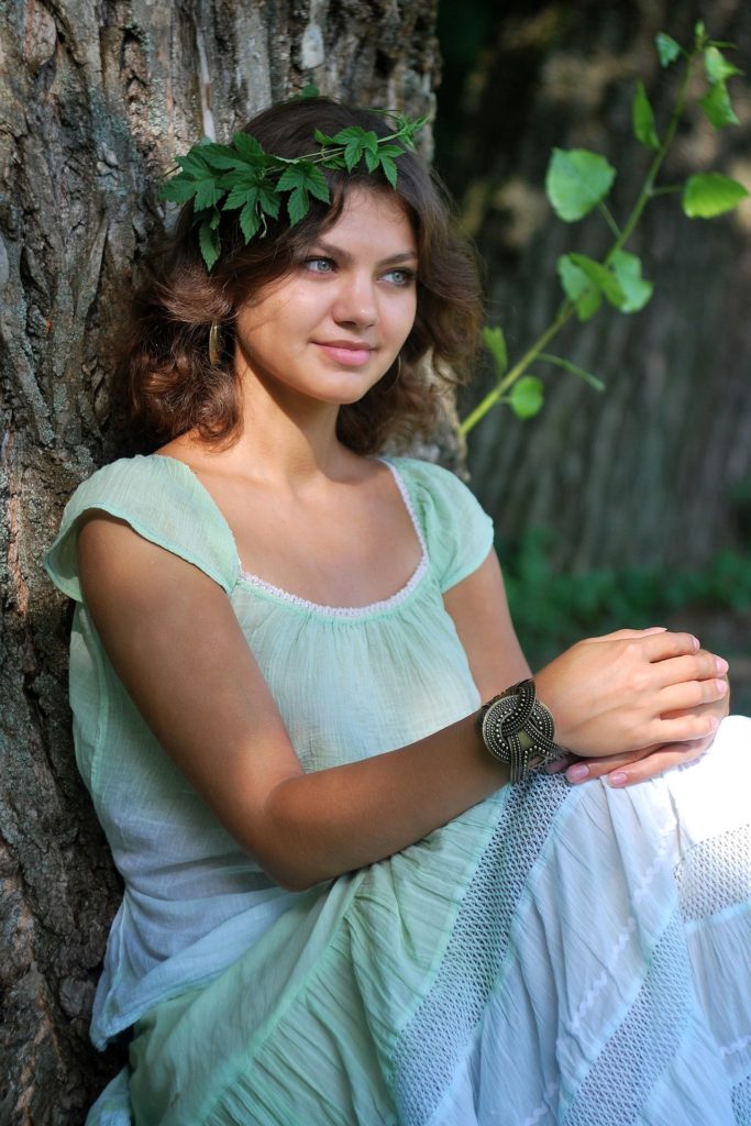 vegan vegetarian hippie nymph in forest sitting next to tree dietary myths